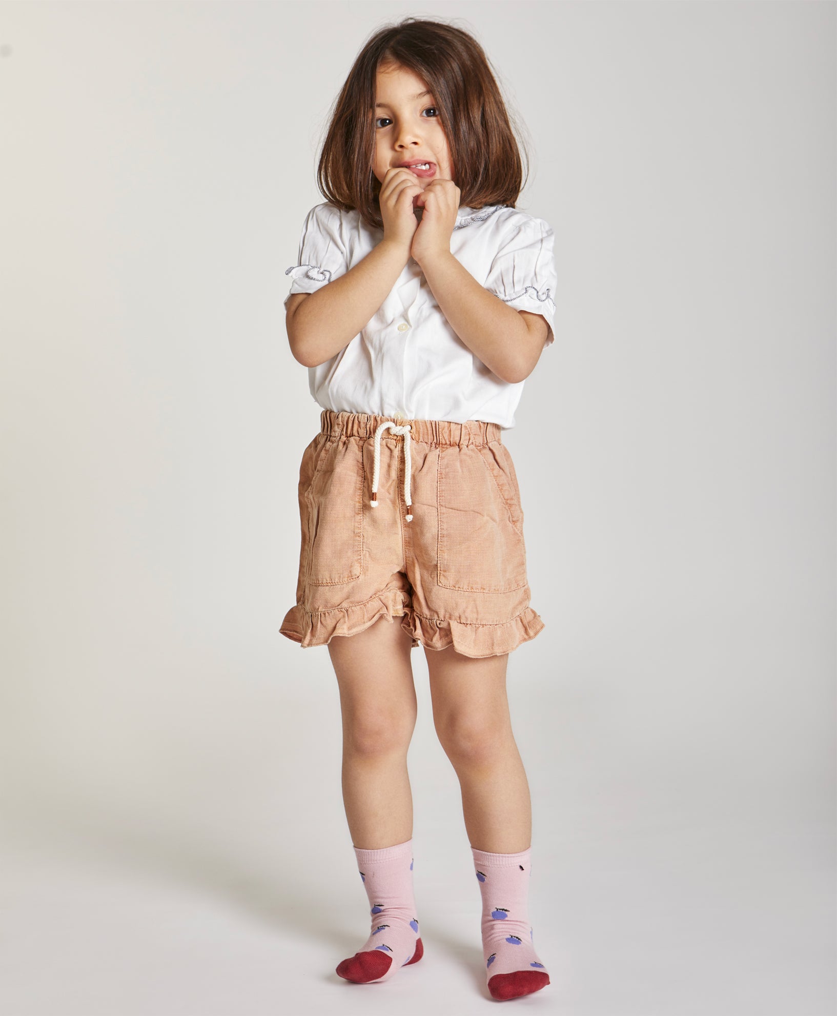 Calze da bambina di Arturo Stories. Fondo rosa, susine viola, punta e tallone rosso mattone. Da zero a otto anni.