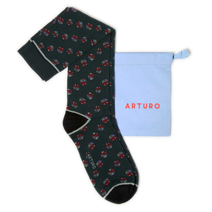 Calze fantasia nel pallone verde bosco da uomo. Lunghi, con palloni colorati, punta e tallone neri e profilo bianco.