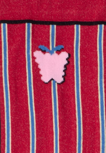 Dettaglio dei calzini a righe verticali mattone da donna di Arturo Stories. Righe celesti e gialle, disegno di un frutto, punta e tallone gialli, profilo nero.